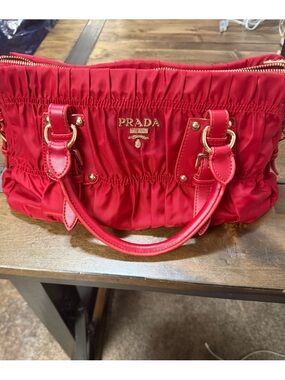 Prada Red Ruched Nylon Satchel
Missing shoulder strap